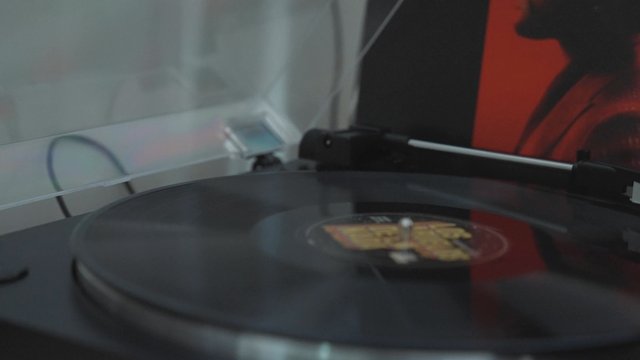 A vinyl disc rotating on a record player