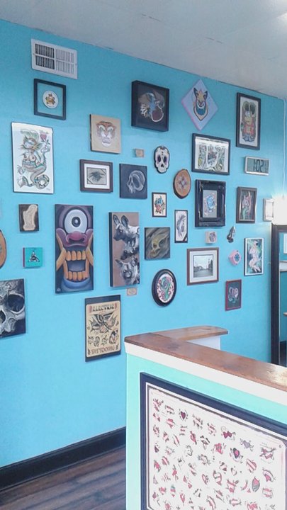 Triumph Tattoo - Big wall of artwork - Piercing Near Me - Louisville, Kentucky