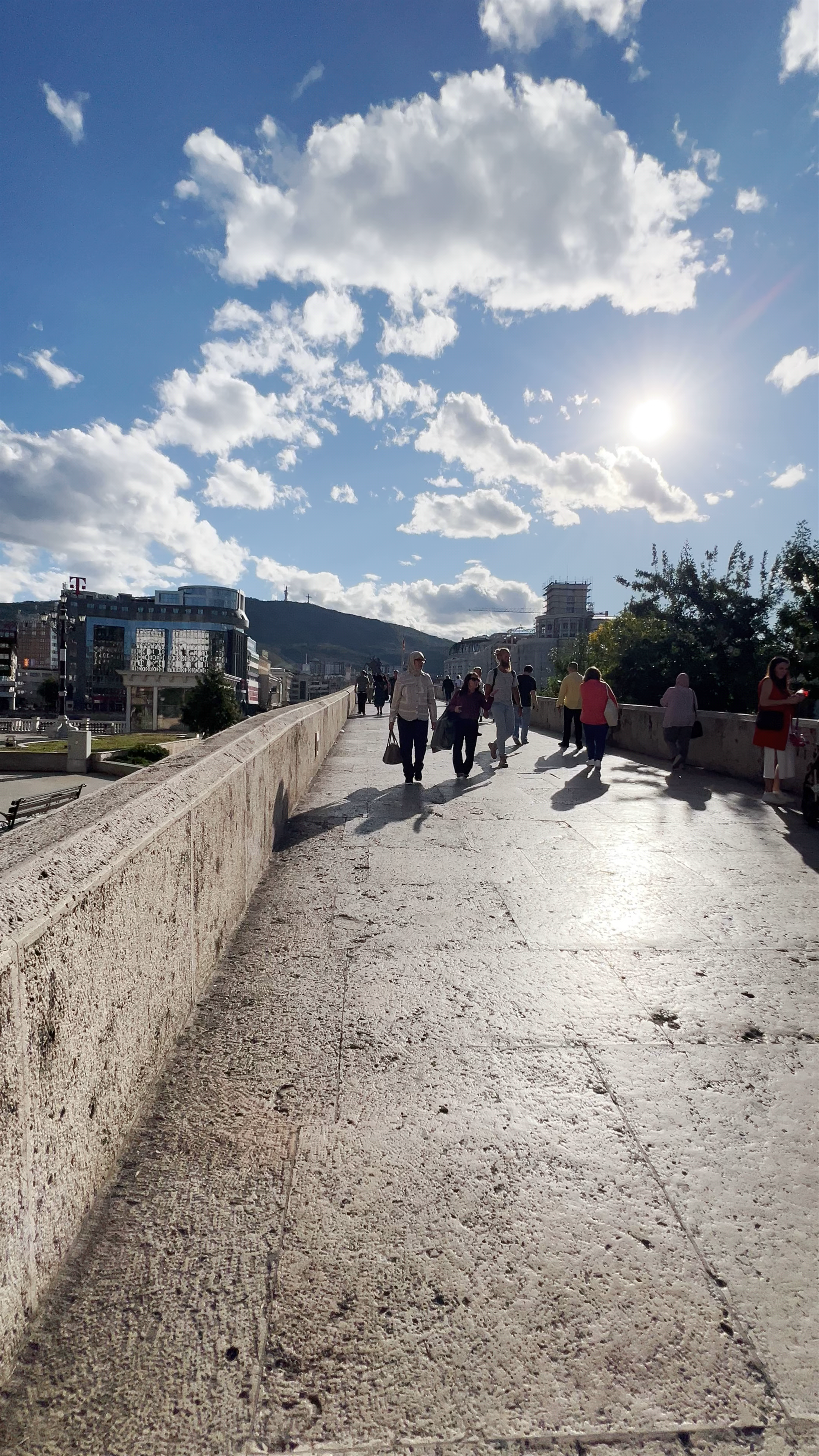 Stone Bridge Walk in Skopje: A Historic Path Under a Bright Blue Sky