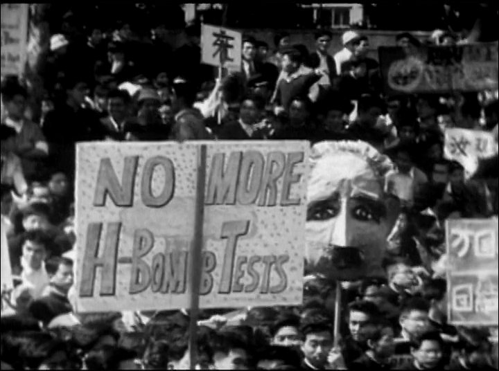 Demonstrators gather for a commemorative walk and public rally opposing nuclear testing. The footage documents organized efforts to advocate for international peace through collective protest.