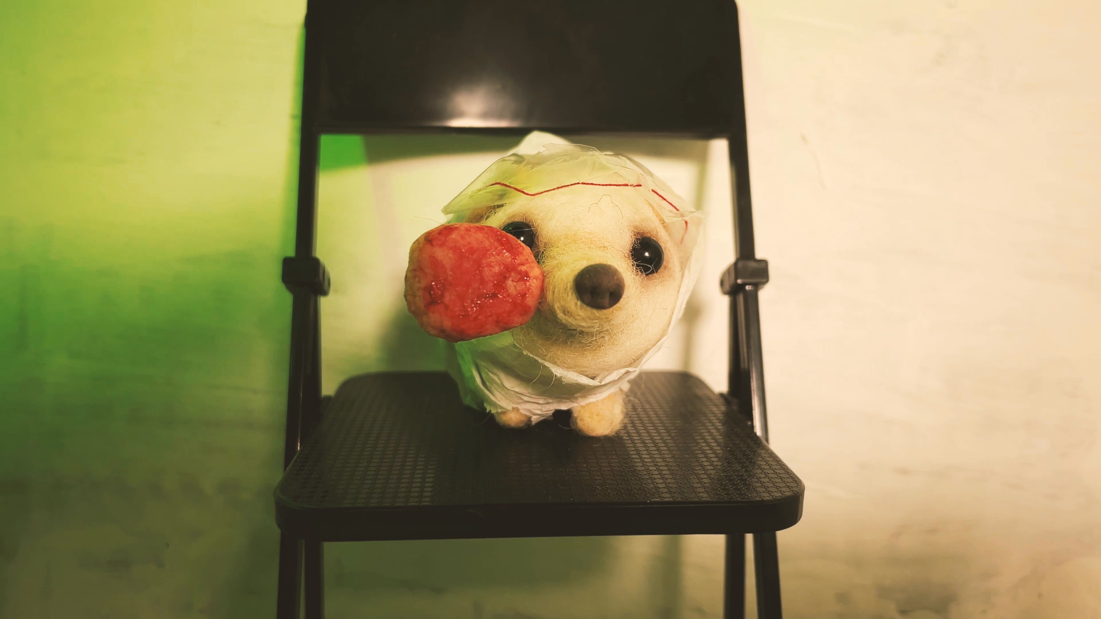 A plush hedgehog toy sits on a chair, serving as the subject for a sequence featuring rapidly shifting colored light filters and visual layering effects.
