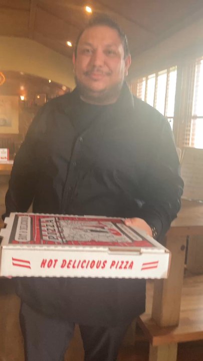 Johnny Carino's - Video of server handing me the pizza - Italian Near Me - Austin, Texas