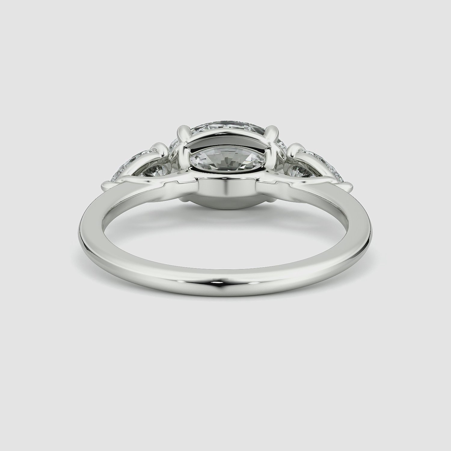 The Three Stone | Oval | Platinum | bandAccent: Plain | diamondOrientation: horizontal | sideStoneCarat: 0.25ct | sideStoneShape: Pear | caratWeight: other