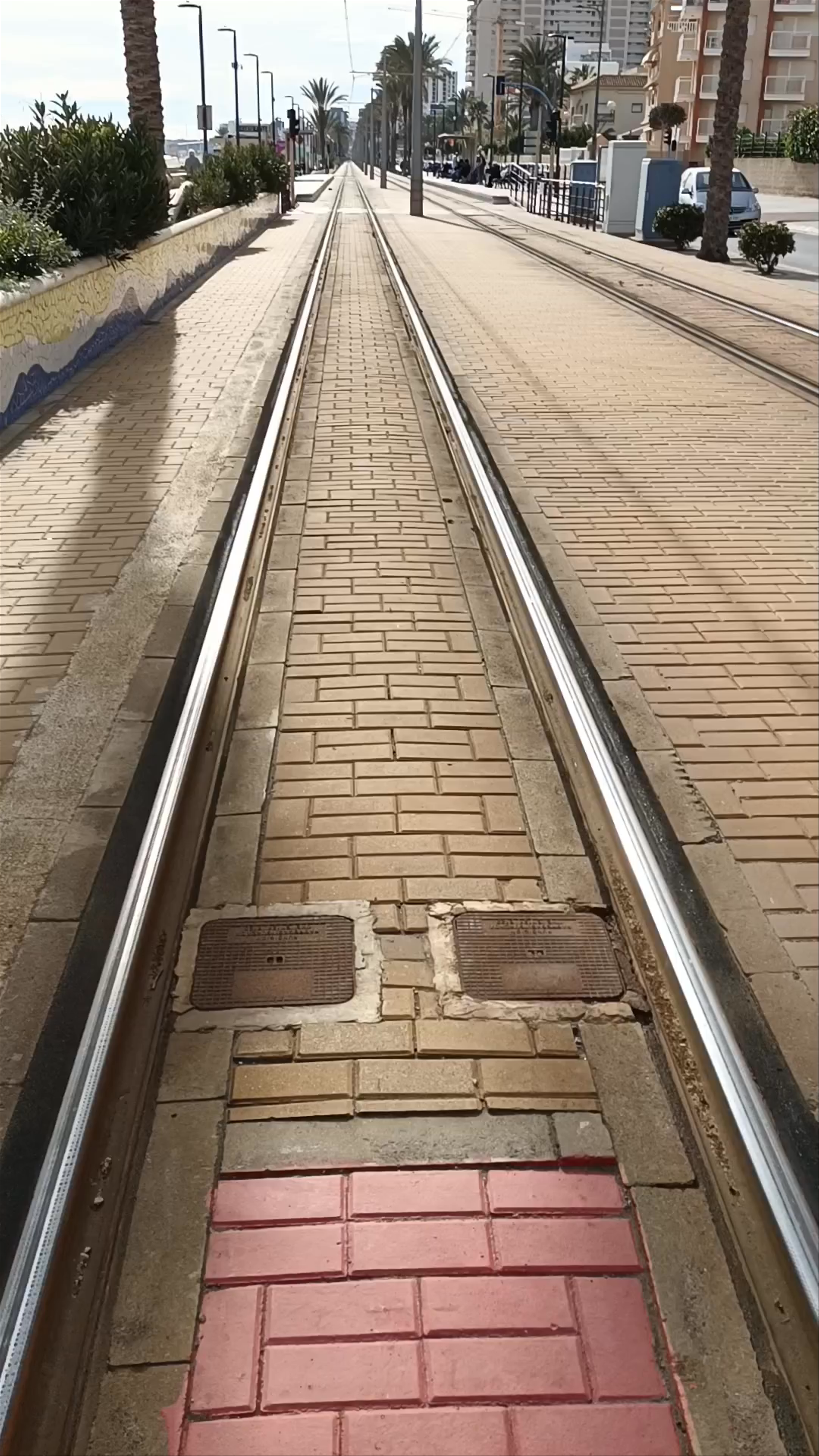 Sunny Tramway Stroll Along Playa Muchavista Beach, El Campello, Spain