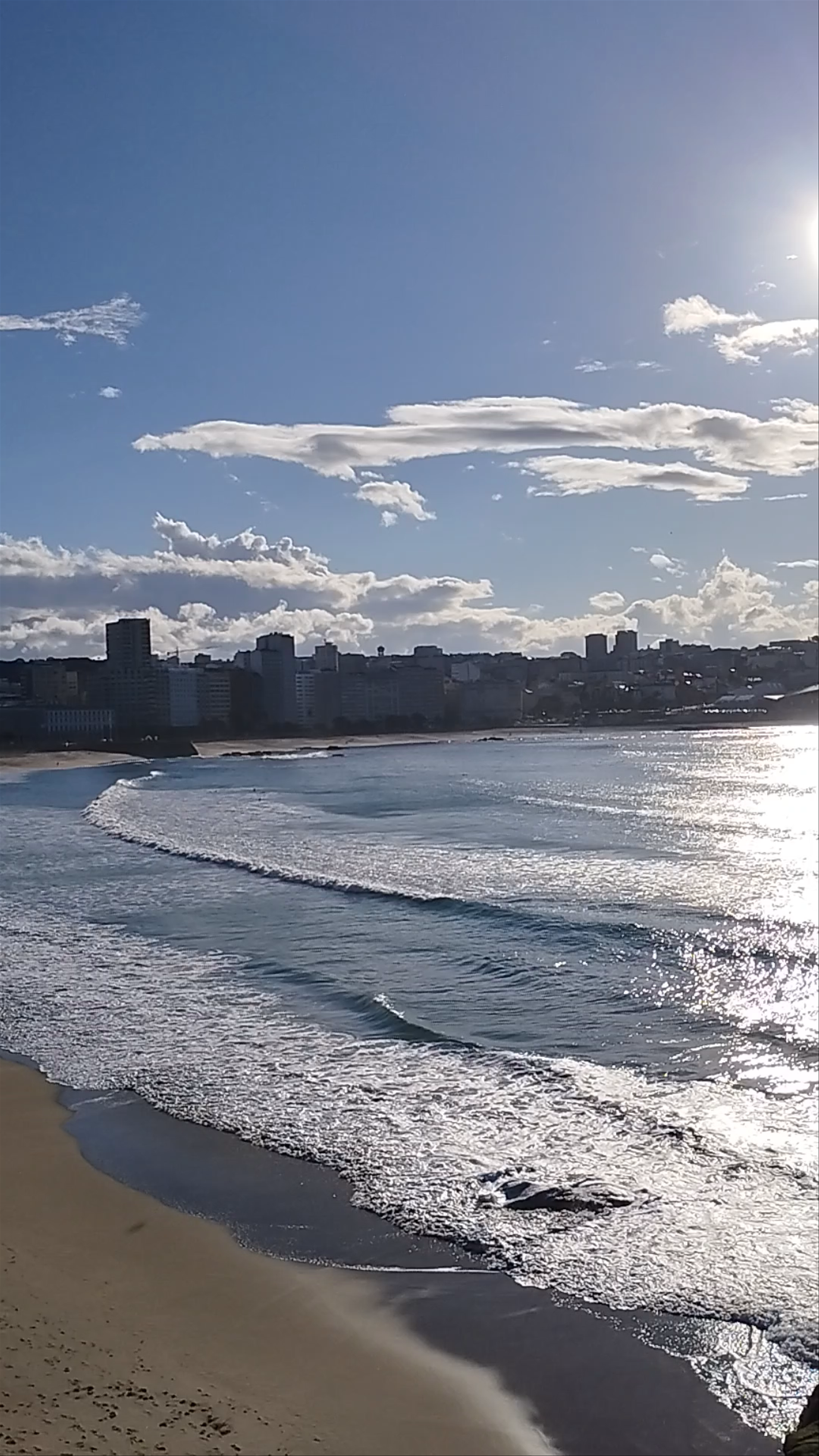 Sunlit Coastal Serenity at Playa del Orzán, A Coruña