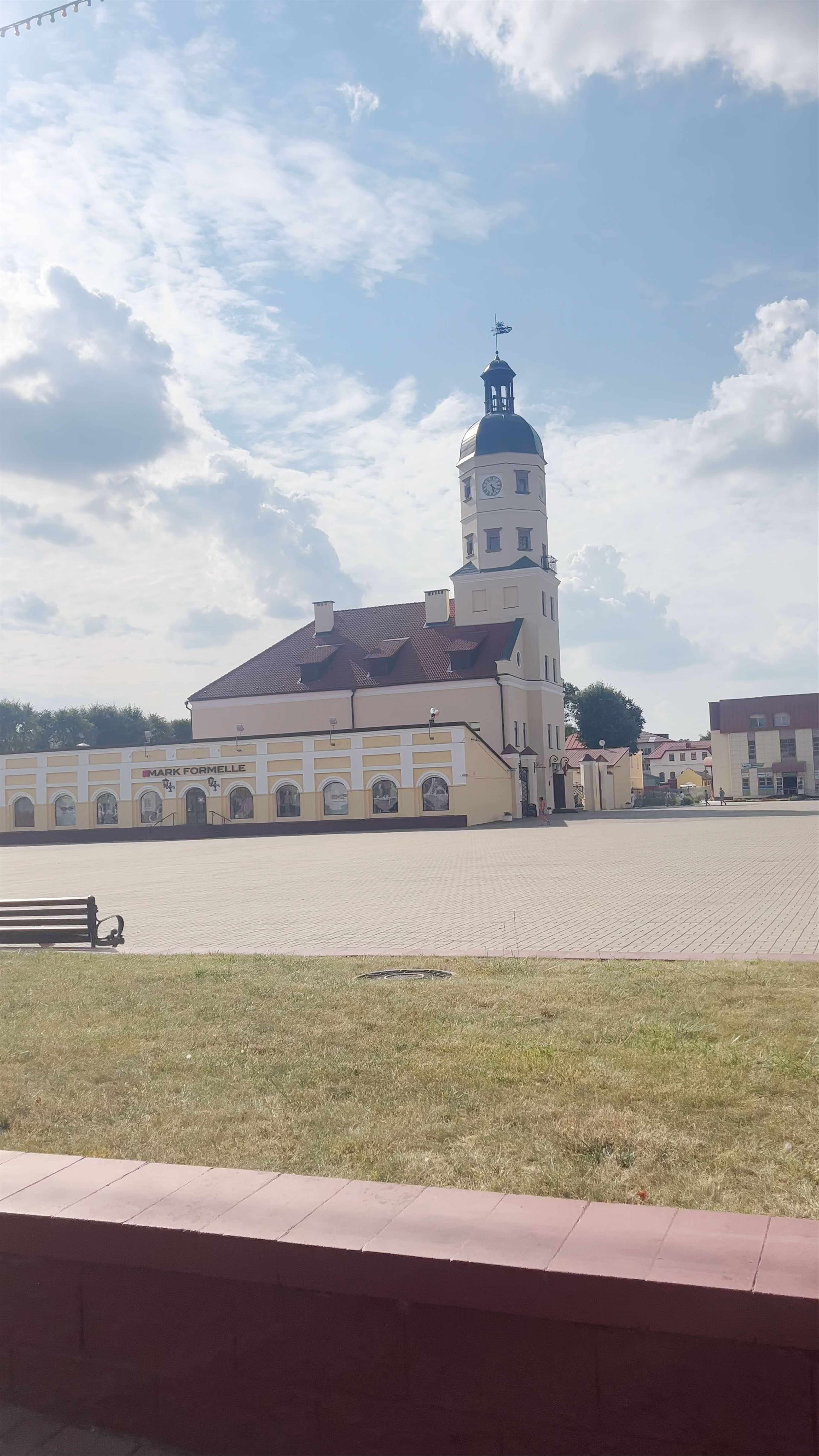 Nesvizh Town Hall: Historic Charm Under a Blue Sky