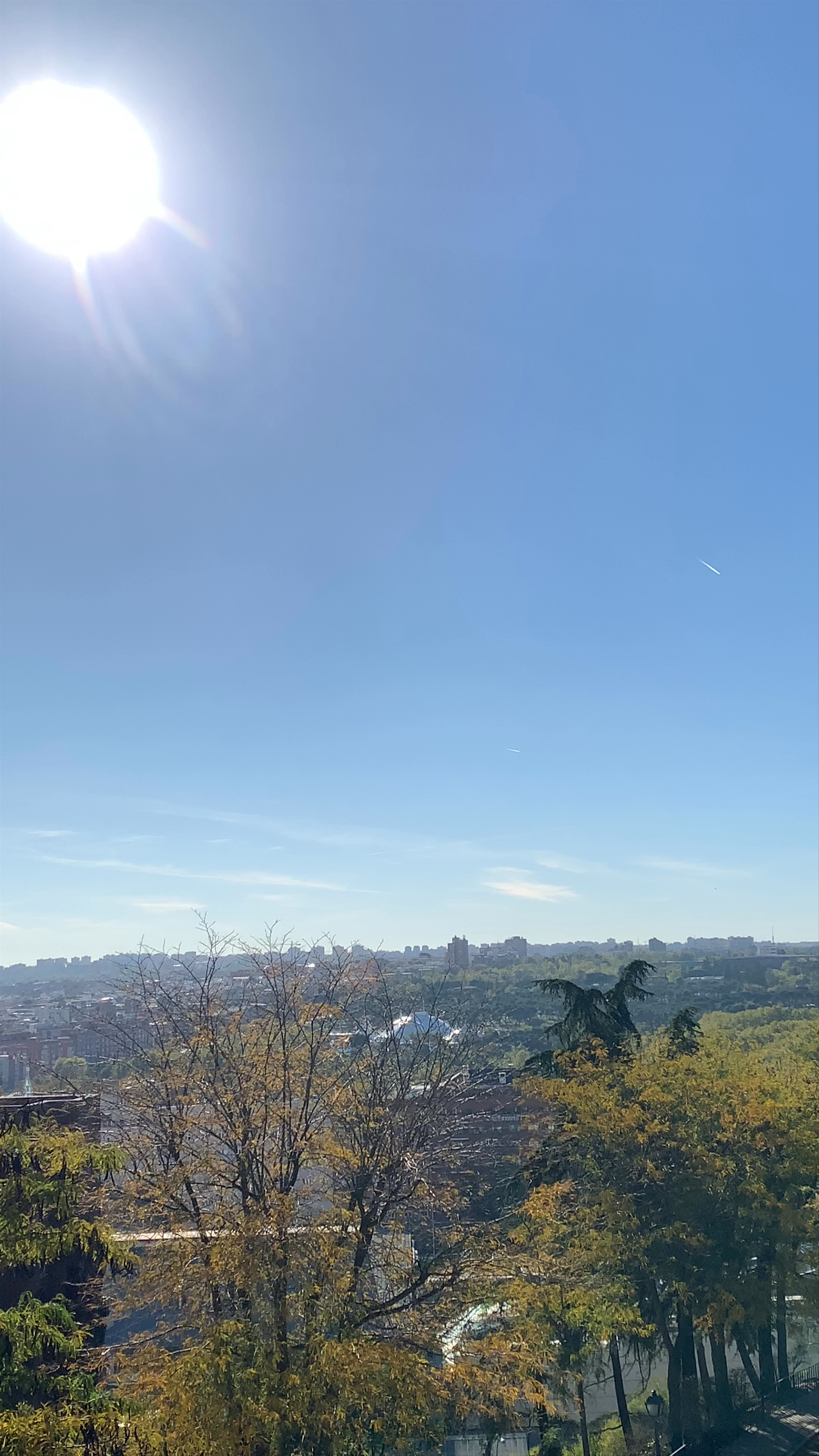 Sunlit Panorama over Parque del Oeste in Madrid