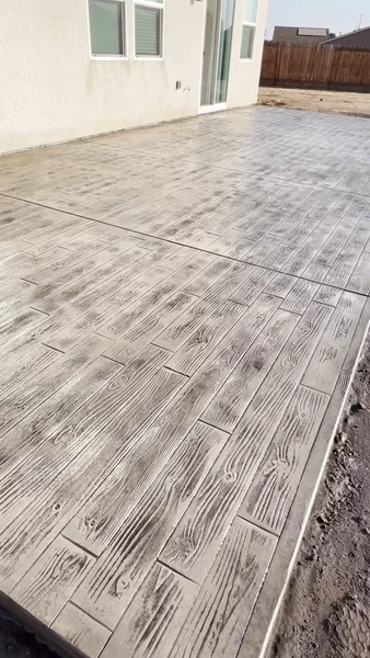 Stamped concrete patio with wood plank pattern