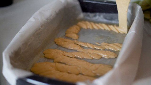 Pouring batter on baking tray