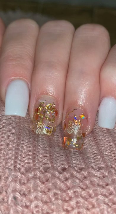 Bloomfield Nails & Spa - White nails with two transparent nails with light glitter and butterfly stickers! - Nail Salons Near Me - Troy, Michigan