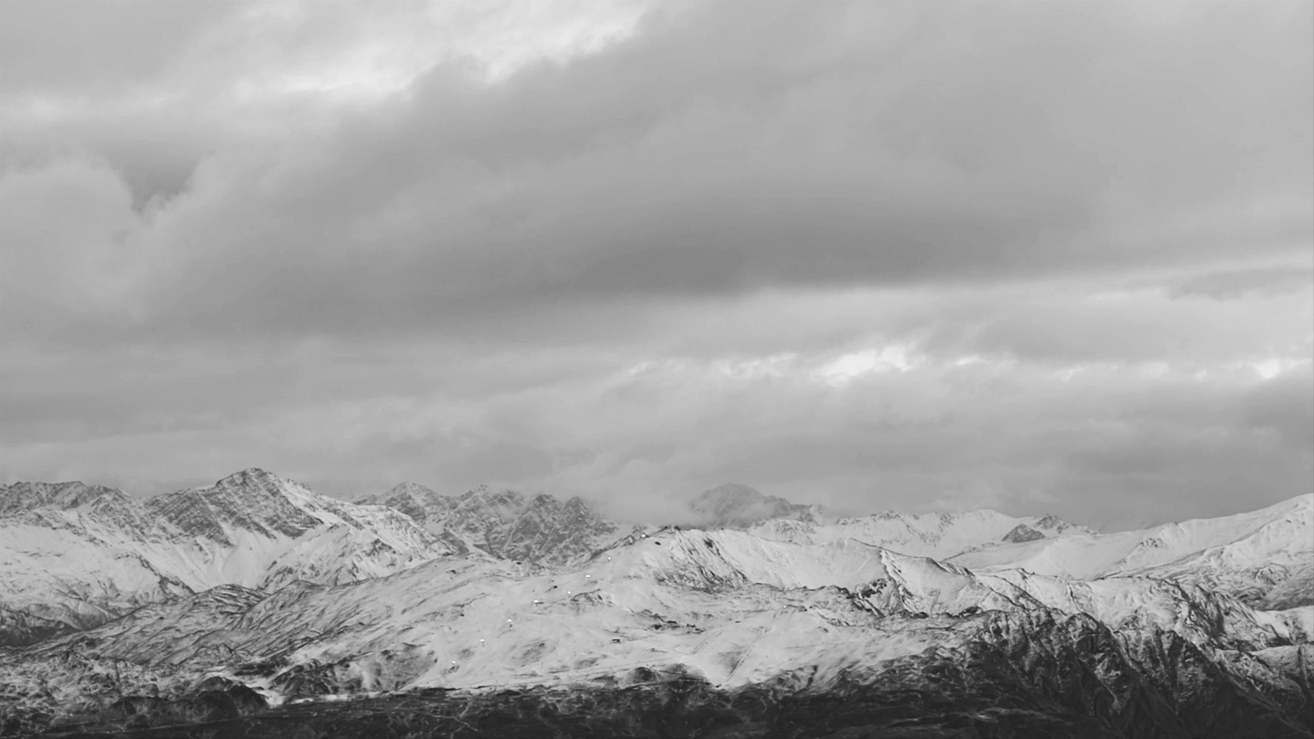 Timelape video of clouds rolling over snowy mountain in New Zealand