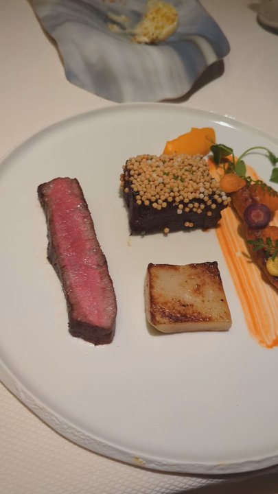 The Umstead Hotel - Herons Course 3 of 4. Beef. Two styles (strip steak and short rib), farm carrots, sea buckthorn, Shaoxing sauce. - Hotels Near Me - Cary, North Carolina