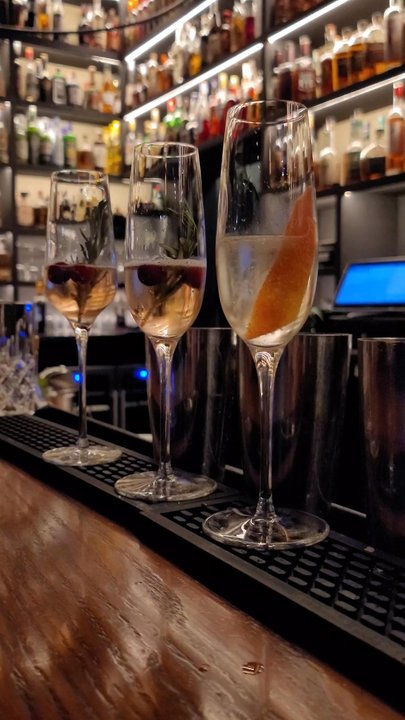 Dram & Draught - Sparkling champagne toasts for NYE 2023 - Wine Bars Near Me - Durham, North Carolina