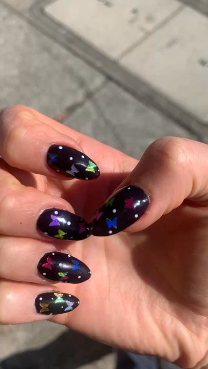 Anna Nails - Gel X in short almond, jelly black polish, multicolor butterfly glitters, and tiny white dots!! - Nail Salons Near Me - Castro Valley, California