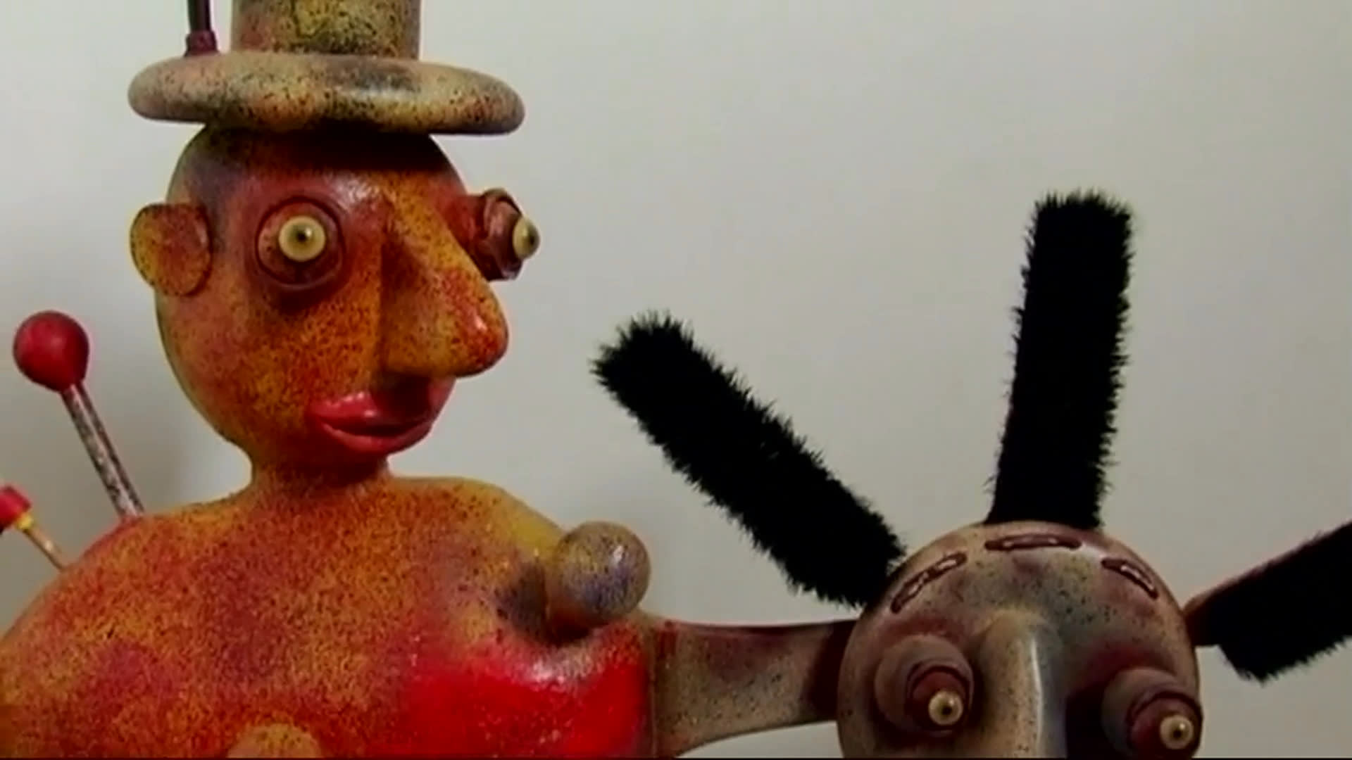 René di Rosa discusses how acquiring art is his greatest pleasure as the sequence moves among vivid paintings, playful sculptures, and an outdoor installation. He speaks from a leafy garden setting, surrounded by works from his collection.