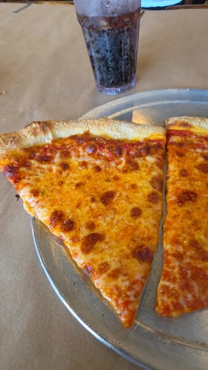 Amici's Pizza Cafe - I had to use 5 napkins to wipe off grease. What a disgrace. And pizza had huge flop. Be careful potential customers you have been warned - Italian Near Me - Coconut Creek, Florida