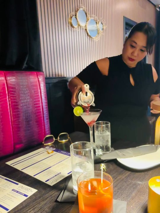 UnCork'd Kitchen & Bar  - Serving a cocktail table side - Cocktail Bars Near Me - Tucson, Arizona