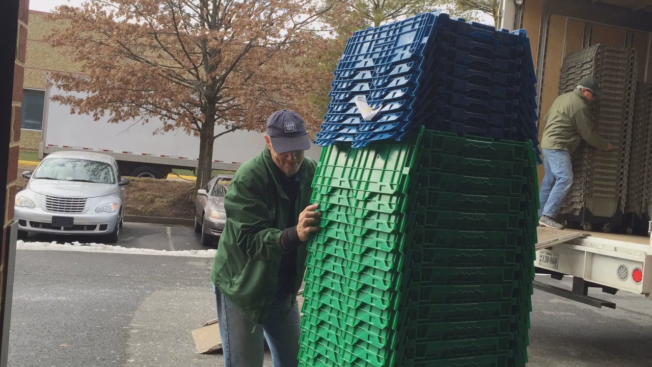 MG Moving Services - Unloading the Lend A Box boxes and dollies from the moving truck to our new warehouse location. - Movers Near Me - Sterling, Virginia