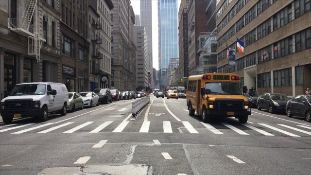 Cars driving on busy street