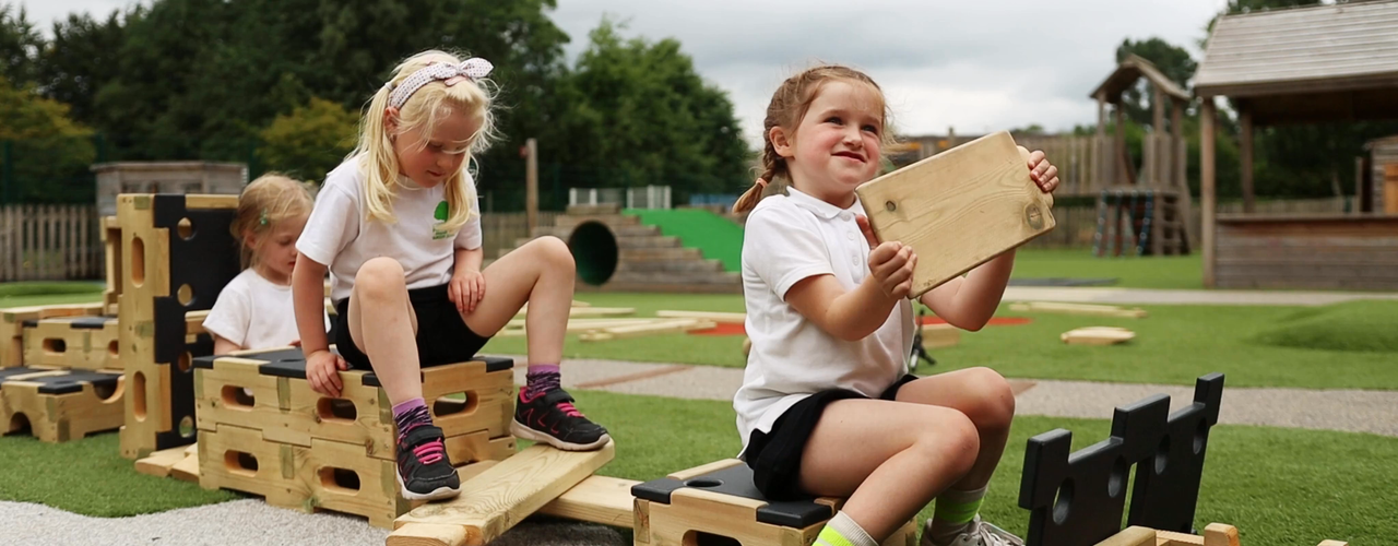 A group of school children playing in a school playground