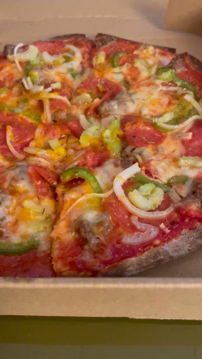 Chalet Pizza - Look at that thin crust! Edges are dark- bottom is not! - Pizza Near Me - Eden Prairie, Minnesota