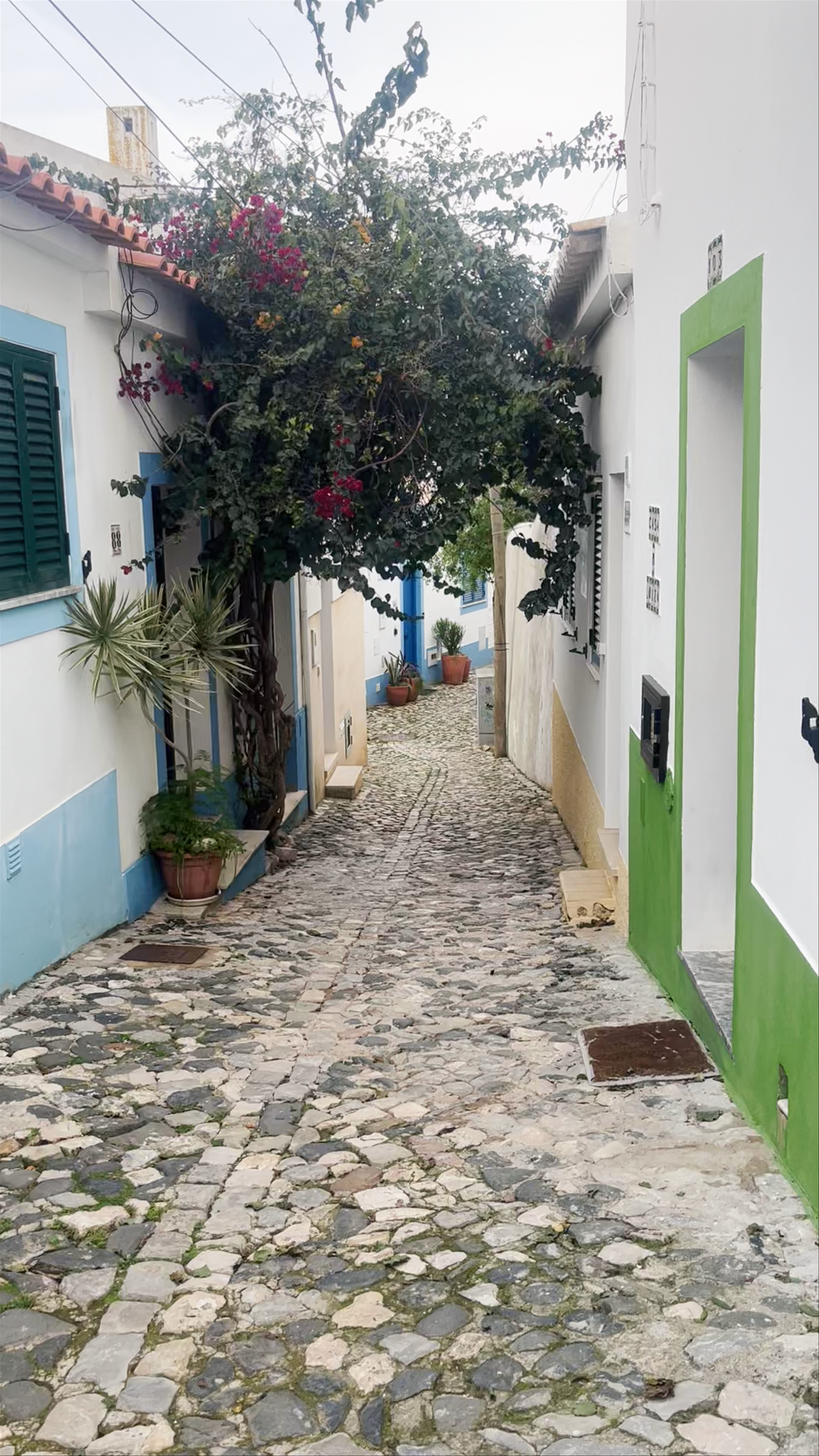 Charming Cobblestone Alley of Praia da Angrinha in Ferragudo, Portugal