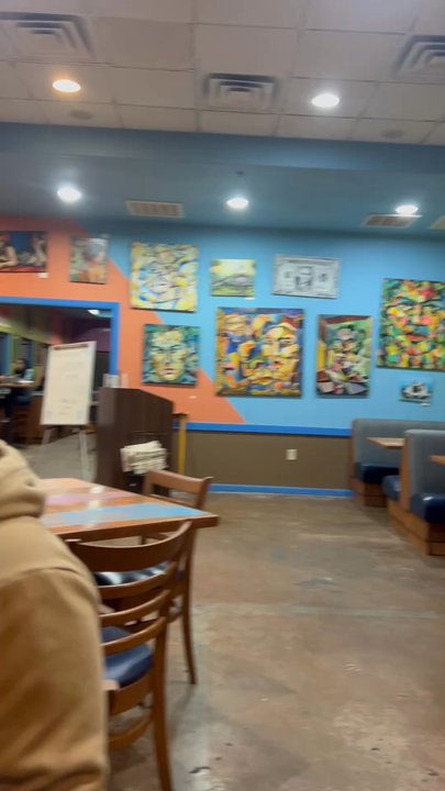 The Blue Onion - inside of dining area + entrance to restrooms - Pizza Near Me - Weslaco, Texas