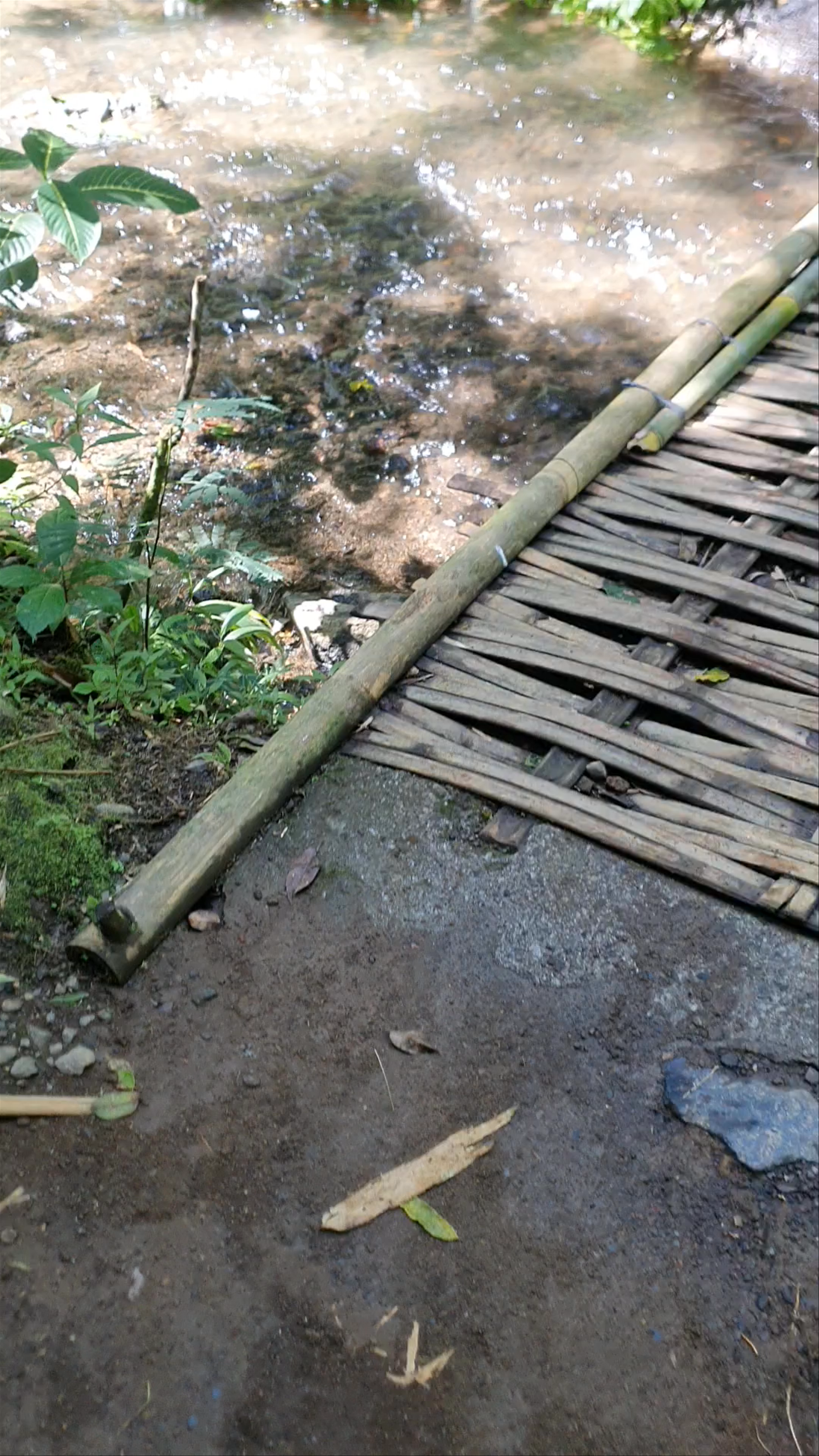 Enchanting Bamboo Bridge over Munduk Stream at Red Coral Munduk Waterfall, Bali
