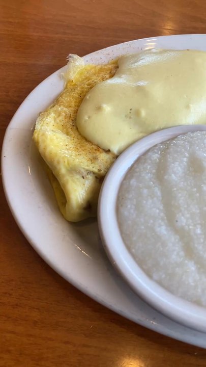 Lenny's Restaurant - DAN's FAMOUS GATOR OMELETTE Made with fresh Florida Alligator,cheddar cheese, sauteed onions, and Hollandaise - grits & home fries - Breakfast & Brunch Near Me - Clearwater, Florida