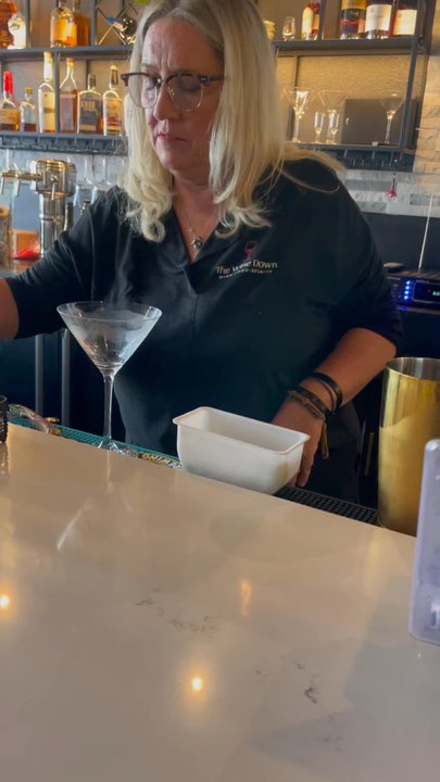 The Wine Down - Joelle, owner, master mixologist making me an amazing dirty gin martini - Cocktail Bars Near Me - Pahrump, Nevada