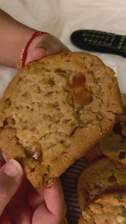 Insomnia Cookies - Cookie monster tearing into warm Carmel Apple cookie - Desserts Near Me - Philadelphia, Pennsylvania