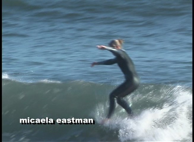 Surfers maneuver across ocean waves in a series of athletic longboard and shortboard performances. The footage highlights technical skill and fluid movement in a marine environment.