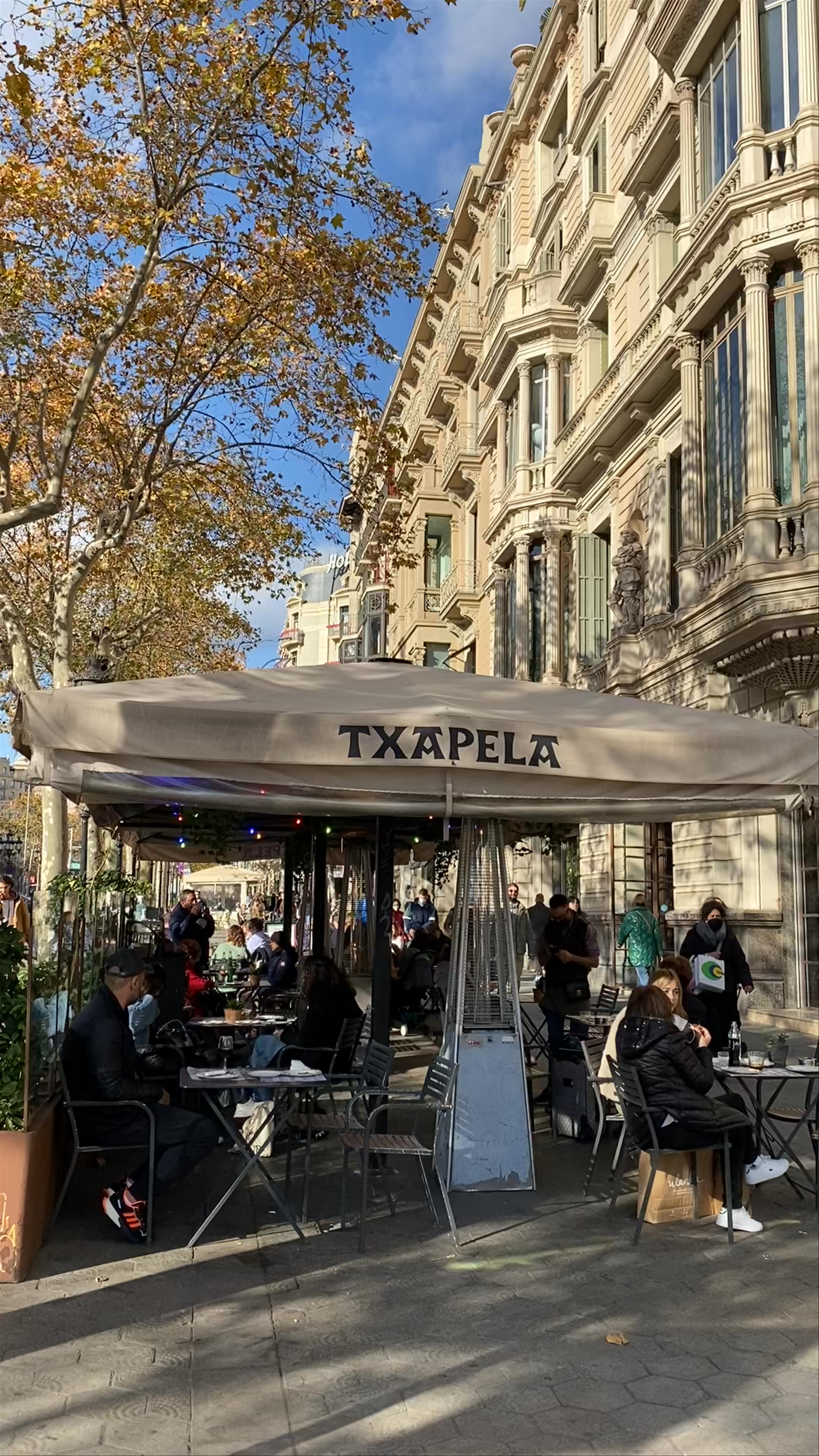 Sunny Outdoor Cafe Vibes on Passeig de Gràcia, Barcelona