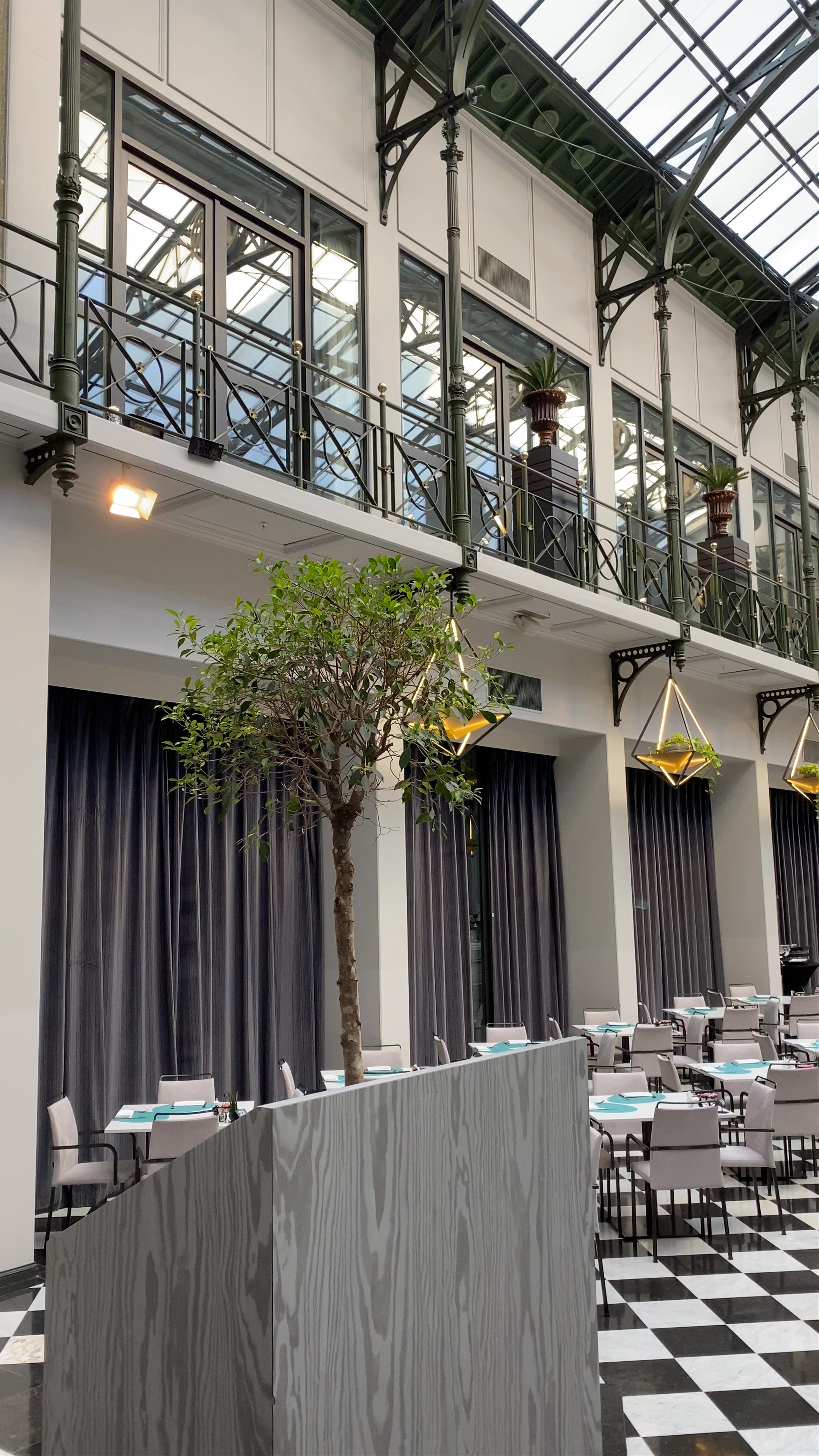 Anantara Grand Hotel Krasnapolsky Amsterdam - Elegant Indoor Dining Under the Glass Roof