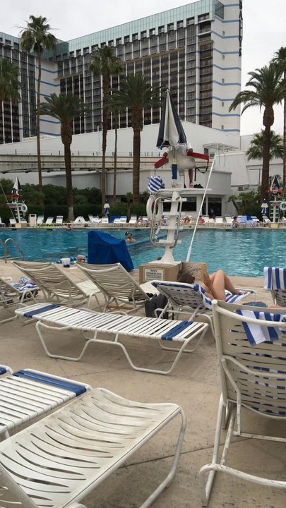 Arcade at the Horseshoe Center Strip - Bigger pool with people drinking in it is up to 12 feet deep. Smaller pool is 3.5 feet deep with kids actually swimming. - Swimming Pools Near Me - Las Vegas, Nevada