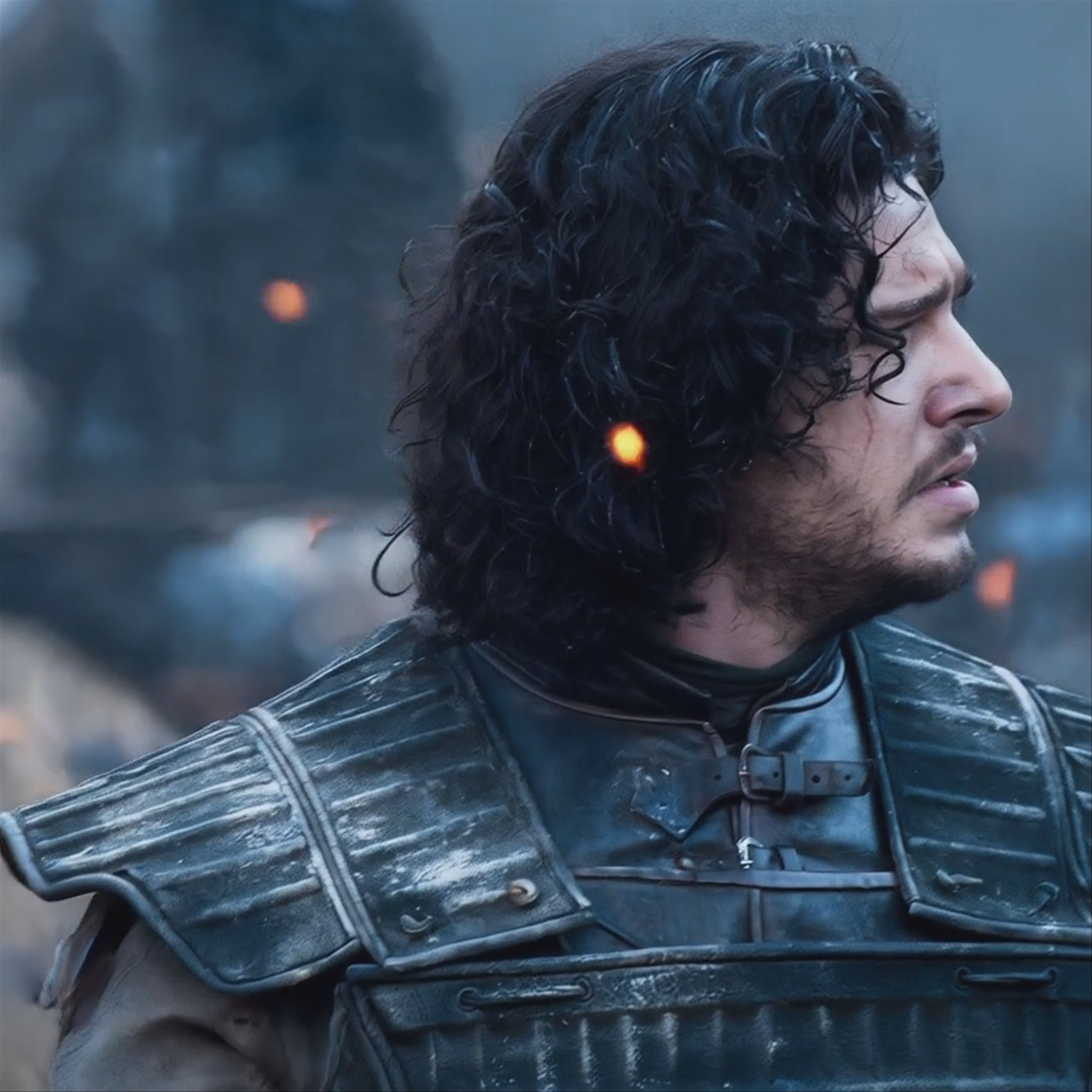 A close-up shot of a battle-worn male warrior with curly dark hair and light facial scars, wearing dark leather armor. He has his eyes closed in exhaustion, with embers floating around him in a smoky battlefield setting. This 1080x1080 video was generated using MiniMax Hailuo 2.3 Fast Pro on Hedra.