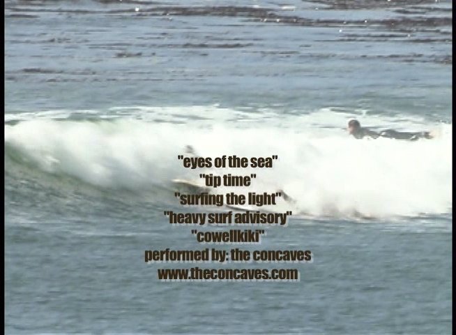 A surfer rides waves in the ocean while demonstrating various surfing maneuvers. The footage highlights skill and movement within a dynamic marine environment.