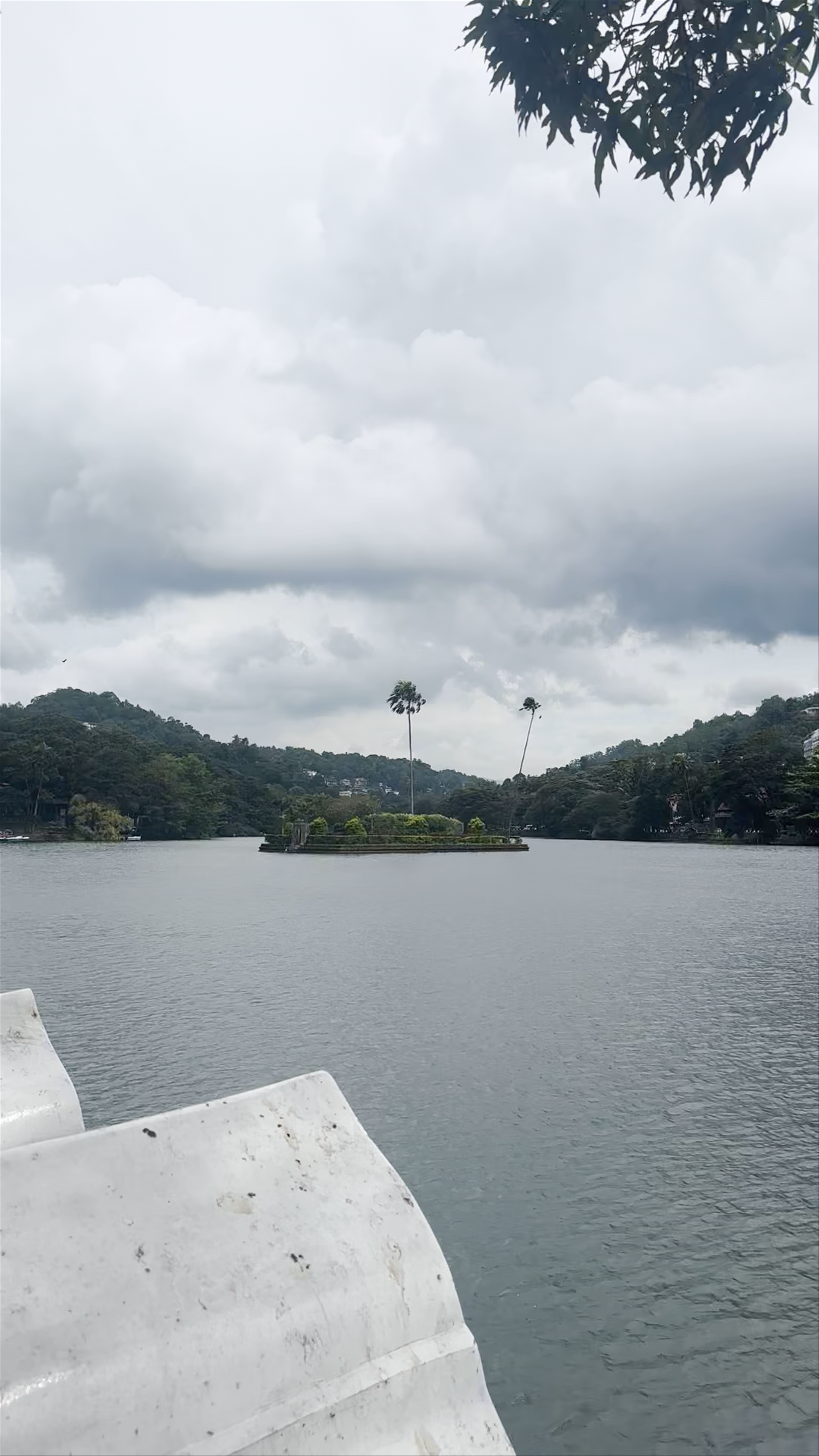 Kandy Lake: Serene Waters and Misty Hills in Sri Lanka