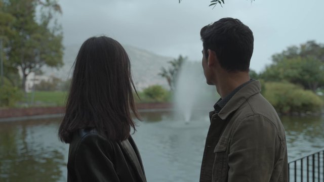 A loving couple in a city park