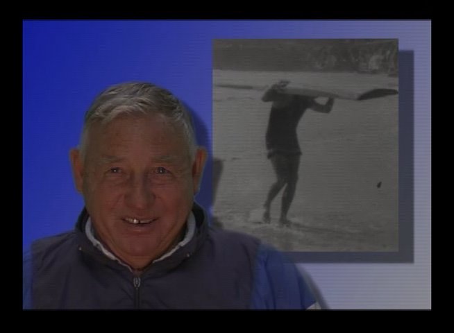 An industry veteran discusses the history of wetsuit materials while showcasing various textile samples and color swatches in a laboratory setting.