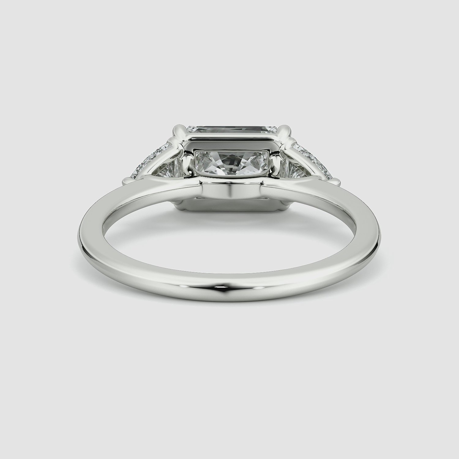 The Three Stone | Radiant | 18k | White Gold | bandAccent: Plain | diamondOrientation: horizontal | sideStoneCarat: 0.25ct | sideStoneShape: Trillion | caratWeight: other