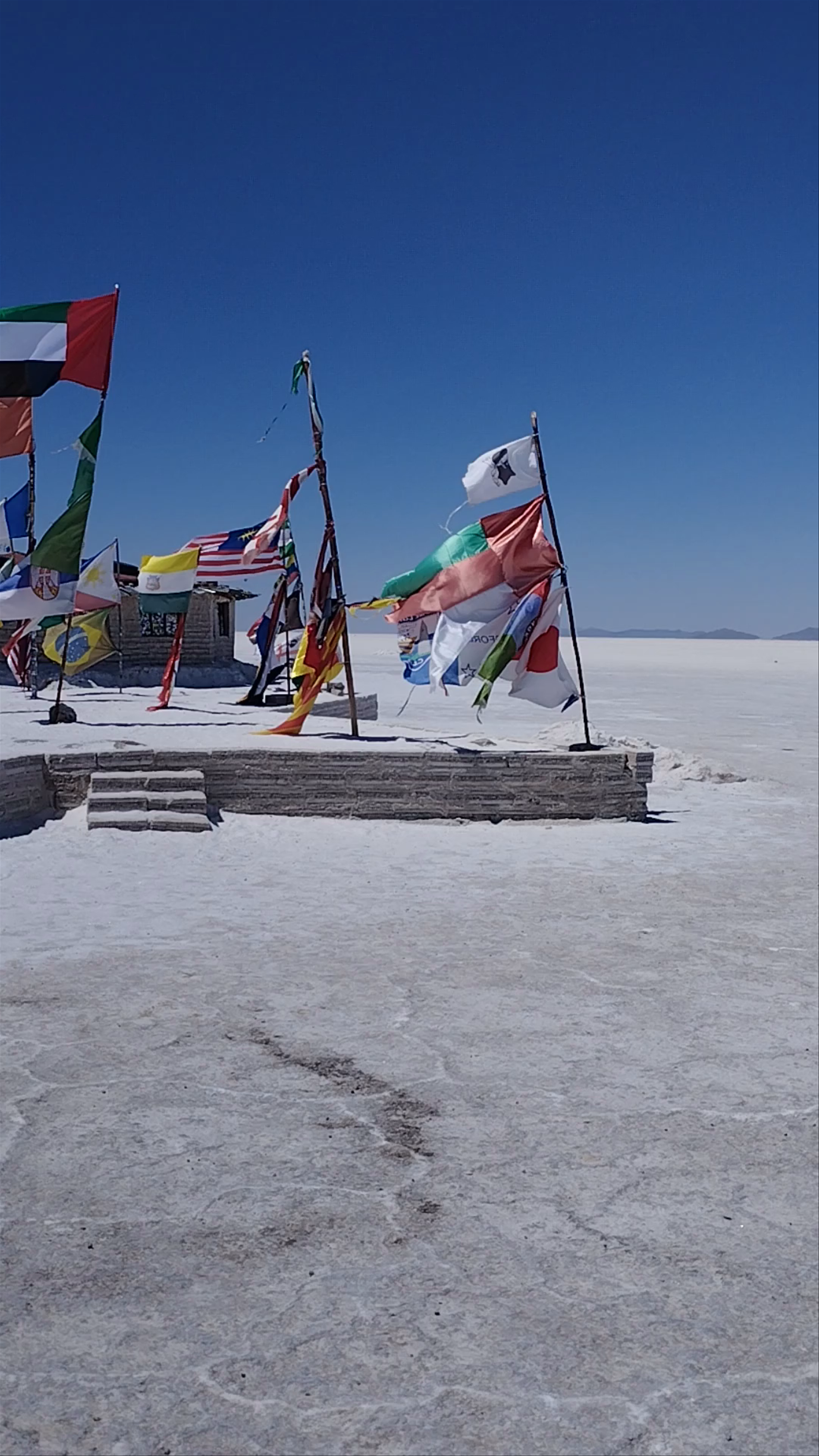Plaza de las Banderas Uyuni: Flags Waving Over the Salt Flats