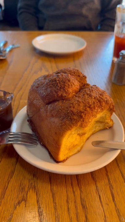 Highlevel Diner - This cinnamon bun is crusty on the top, soft and chewy on the inside. The Carmel sauce poured over top was a dream come true - Diners Near Me - Edmonton, Alberta