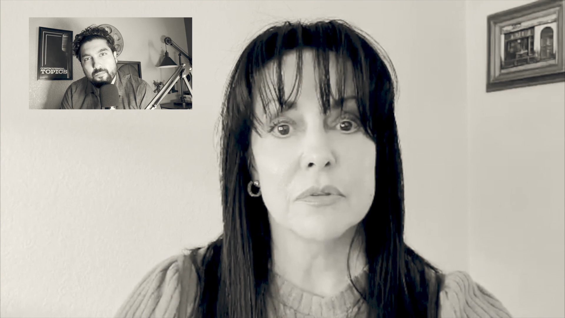 A presenter delivers a direct address during a virtual consultation, clearly articulating information to an audience in a professional setting. The speaker maintains steady eye contact while engaging in a focused, dialogue-driven presentation.