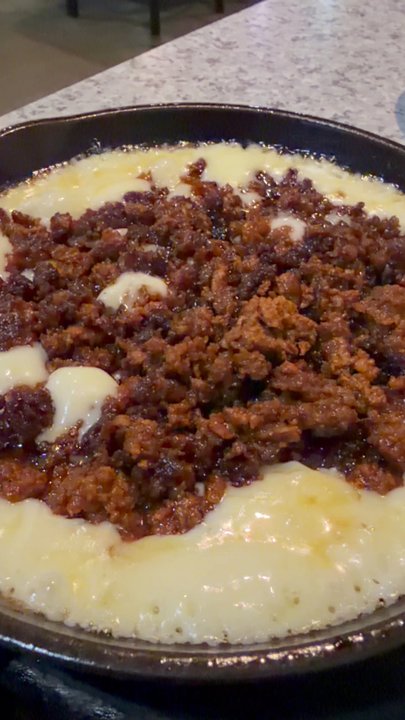 Rancho Grande Restaurant - Queso Fundido. The cheese gets kinda crispy as it sits.  Not bad bites - Mexican Near Me - Olive Branch, Mississippi