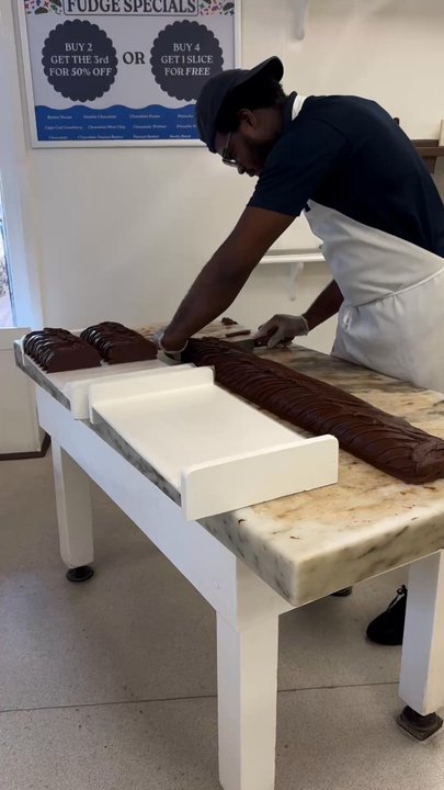 Murdick's Fudge - Double chocolate flavor being sliced - Candy Stores Near Me - Edgartown, Massachusetts