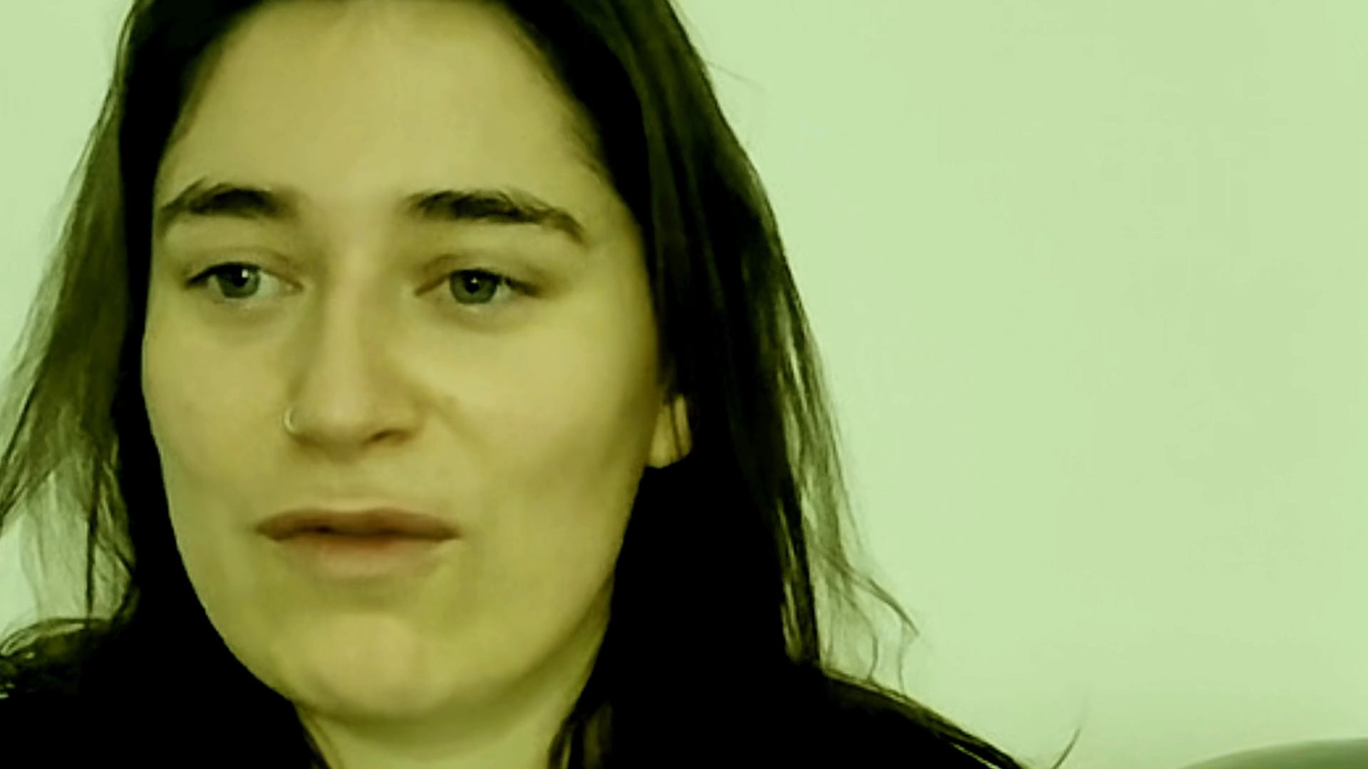 A woman delivers an expressive, dramatic monologue while looking directly into the camera. She shifts through a range of intense facial expressions and vocal inflections.