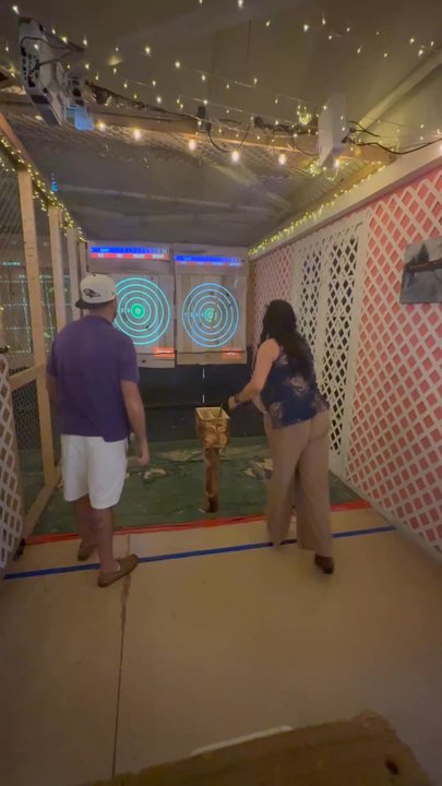 Axgard - It was her first throw.... and she hit the target. Credit to our instructor - Axe Throwing Near Me - Ellicott City, Maryland