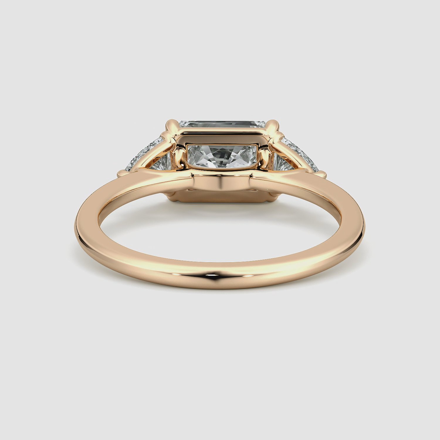 The Three Stone | Radiant | 14k | Rose Gold | bandAccent: Plain | diamondOrientation: horizontal | sideStoneCarat: 0.25ct | sideStoneShape: Trillion | caratWeight: other