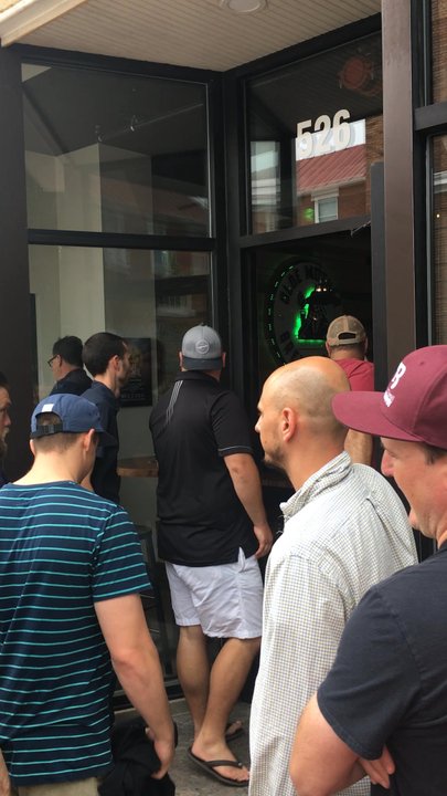 Olde Mother Brewing - Boards of people filing in at opening - Breweries Near Me - Frederick, Maryland